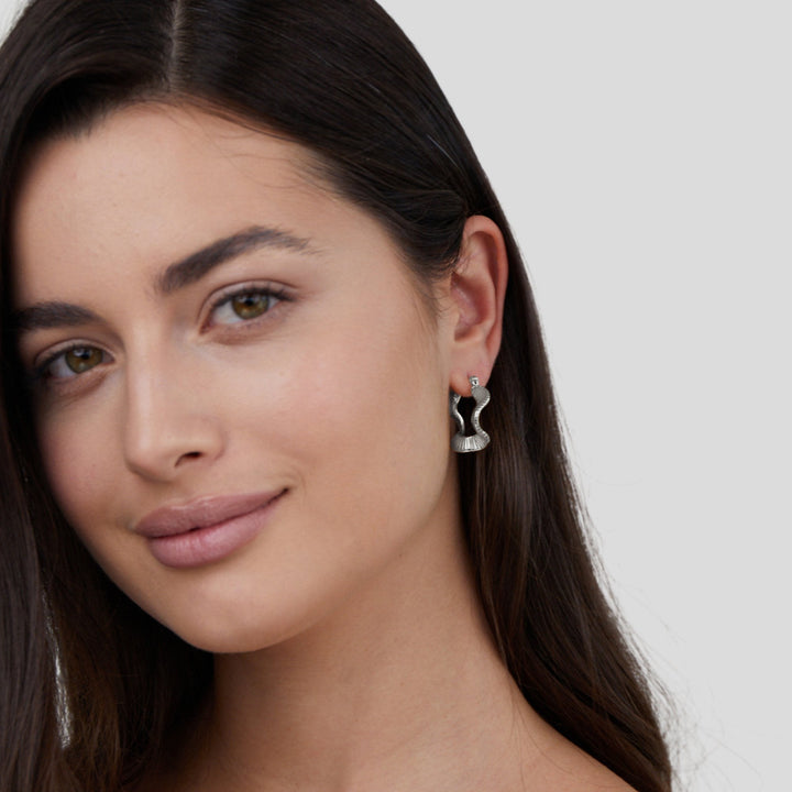 Silver hoops with geometric pattern