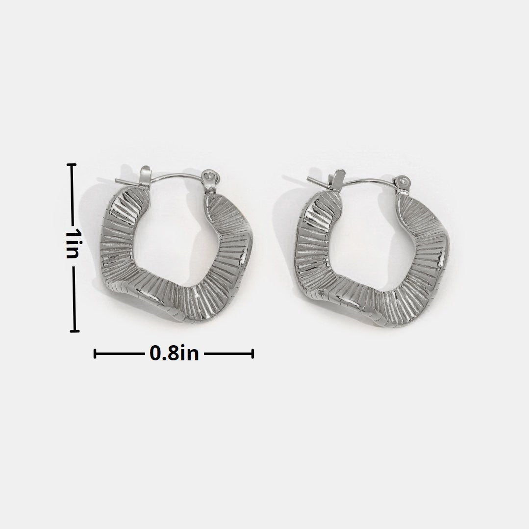 Silver hoops with geometric pattern