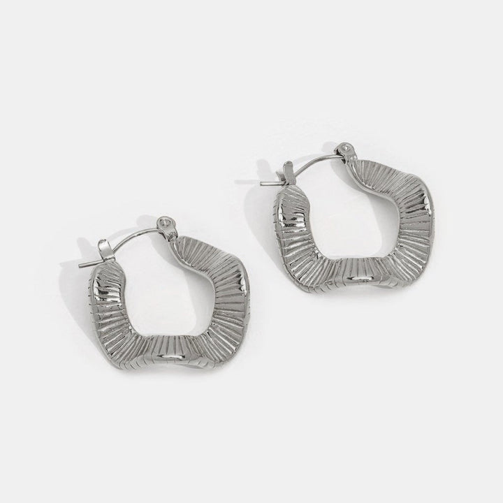 Silver hoops with geometric pattern